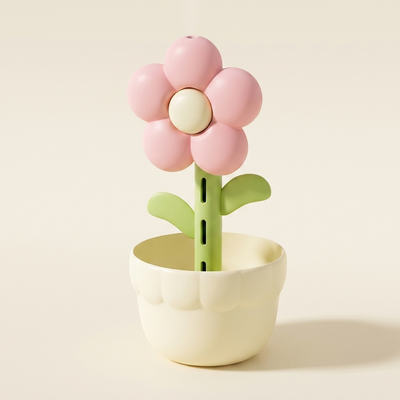 ピンクの花・クリームの鉢のフラワー加湿器（クリーンなスタジオ撮影）