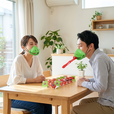 カエル舌ゲームで遊ぶ日本人カップル